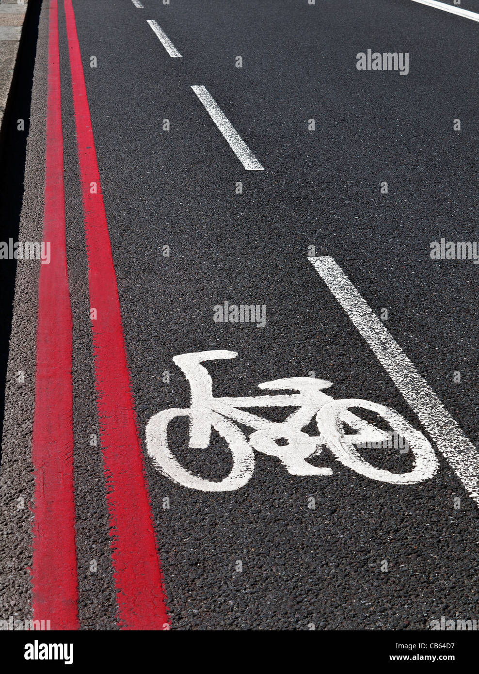 Bicycle lane and no stopping red route double lines in Westminster London UK Stock Photo