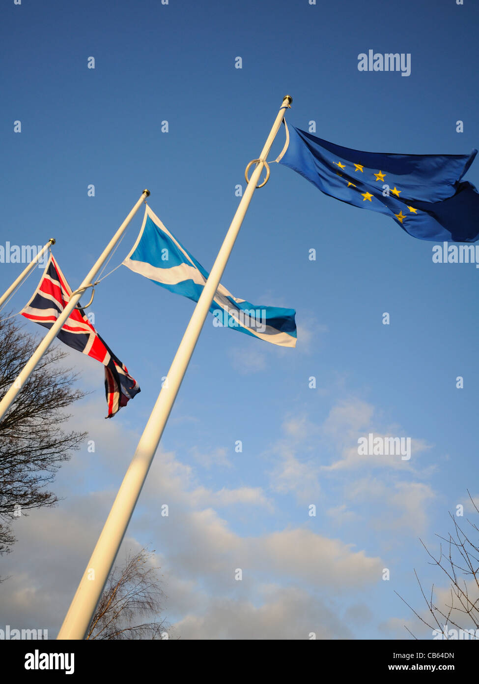 Three flags on flag poles. Stock Photo