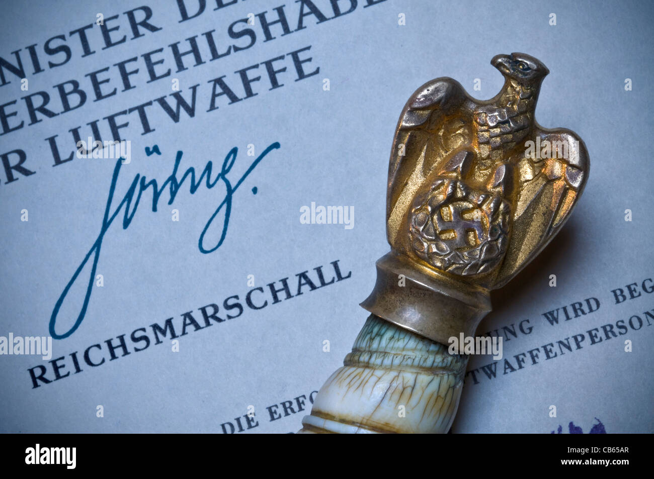 Ceremonial military baton crested with gold eagle and Nazi Swastika on original signed WW2 document from Reichsmarschall Goering Stock Photo