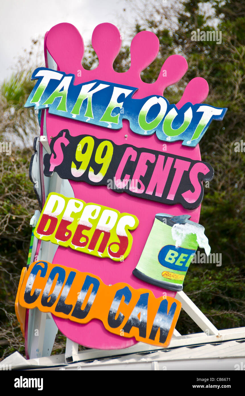 Purple sign for take out beer cheap price St Maarten Philipsburg Front Street Stock Photo