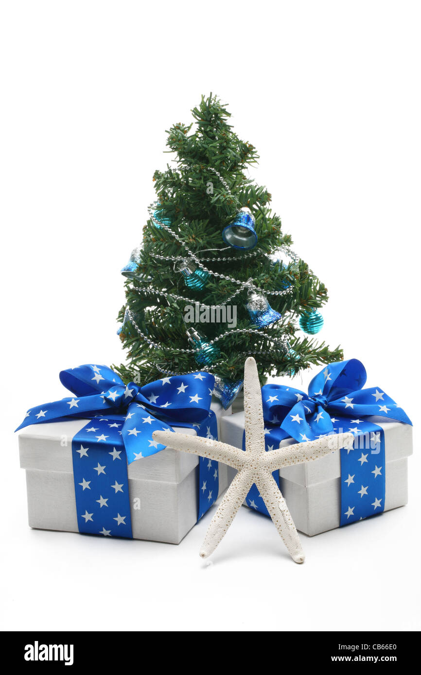 Christmas tree and gifts on white background. Stock Photo