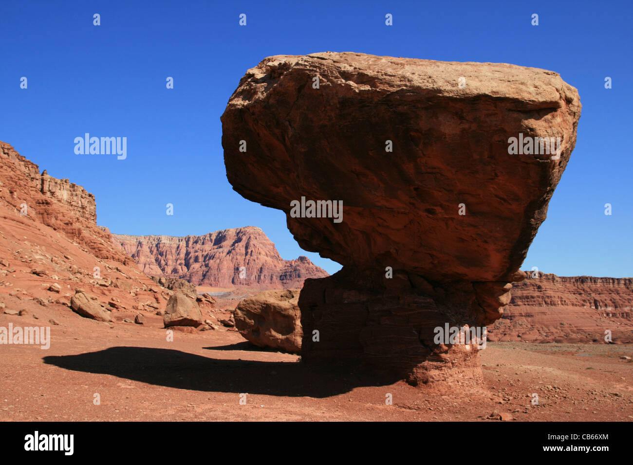 balanced sandstone boulder on shale pedestal in Arizona Stock Photo
