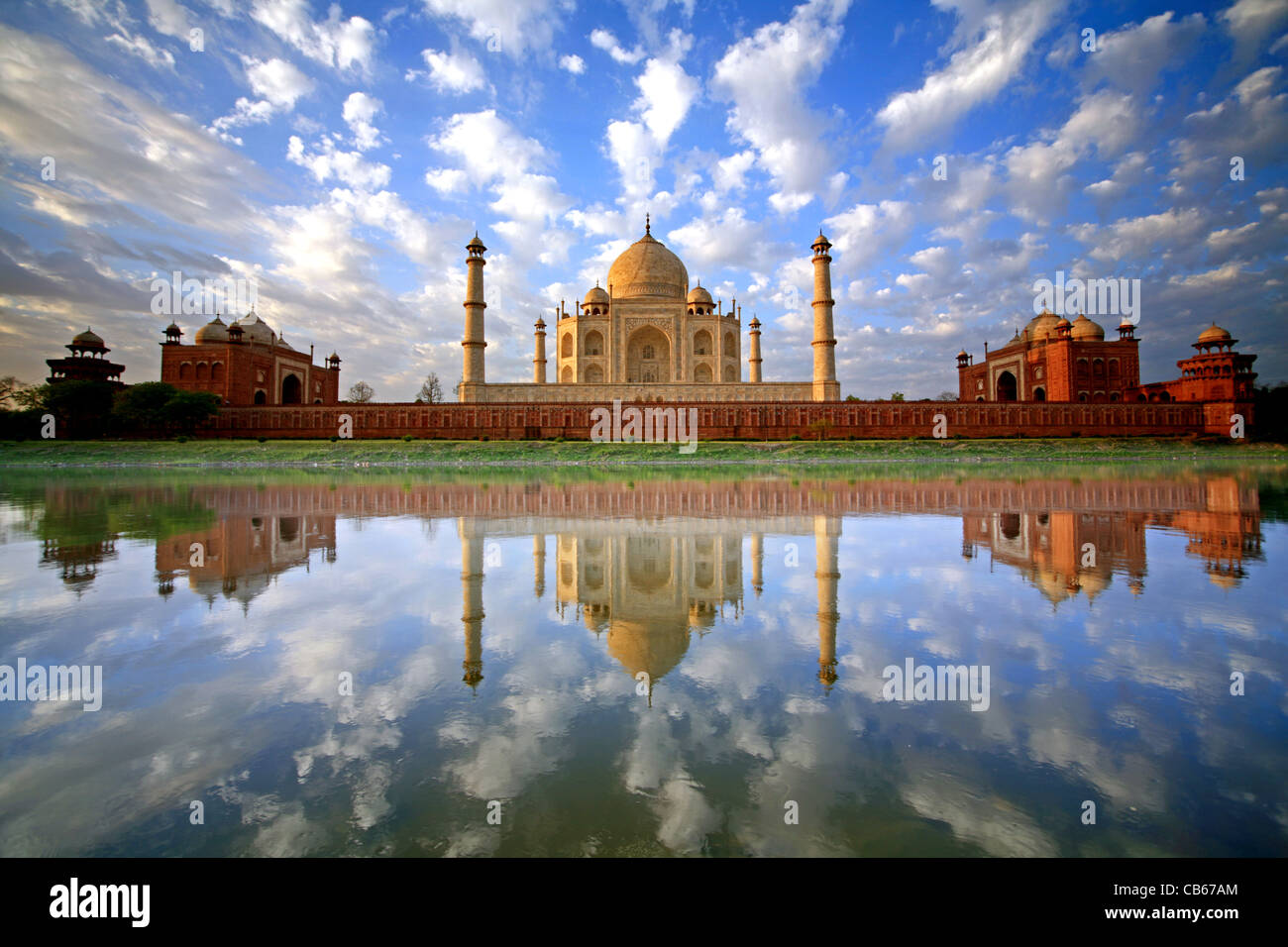 A stunning, once in a lifetime image of a sky full of puffy clouds reflected in the Yamuna River at the Taj Mahal Stock Photo