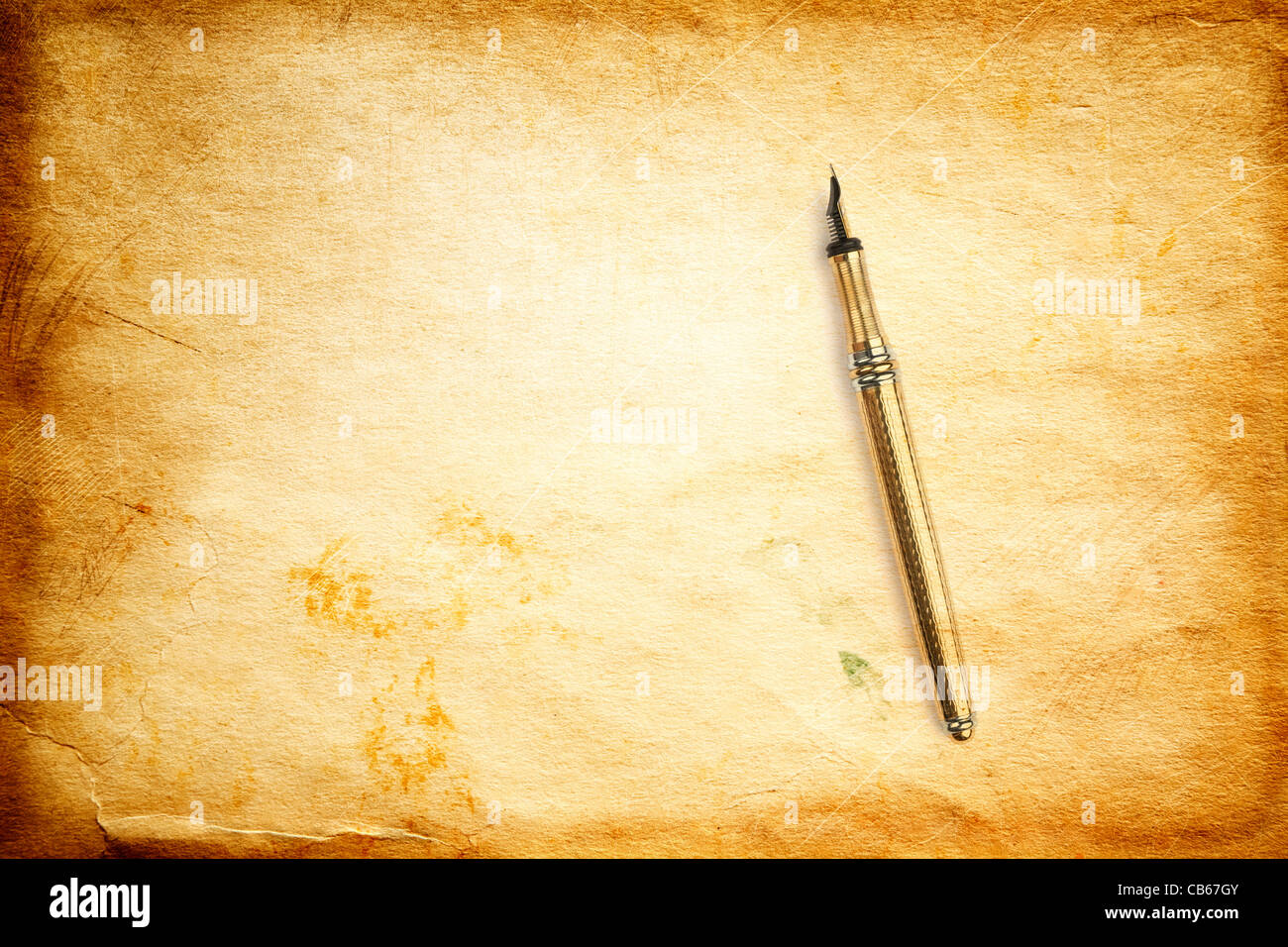 grunge background and golden pen Stock Photo
