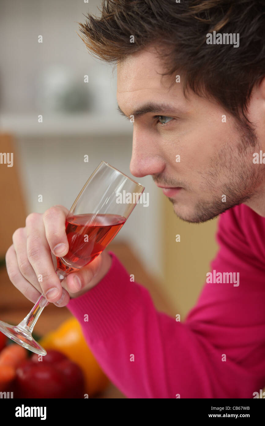 young man drinking wine Stock Photo - Alamy
