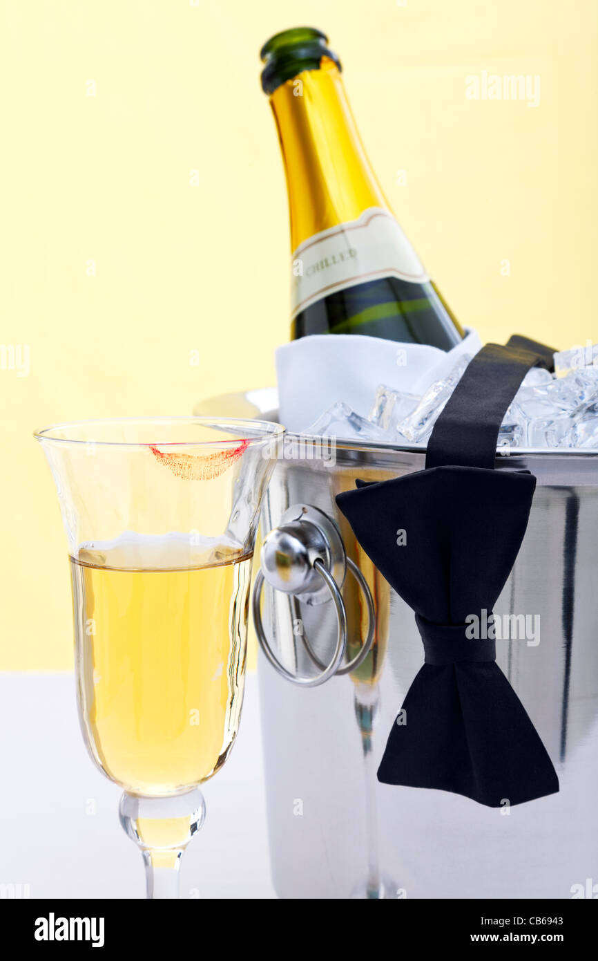 Photo of a bottle of chilled Champagne in an ice bucket with a black