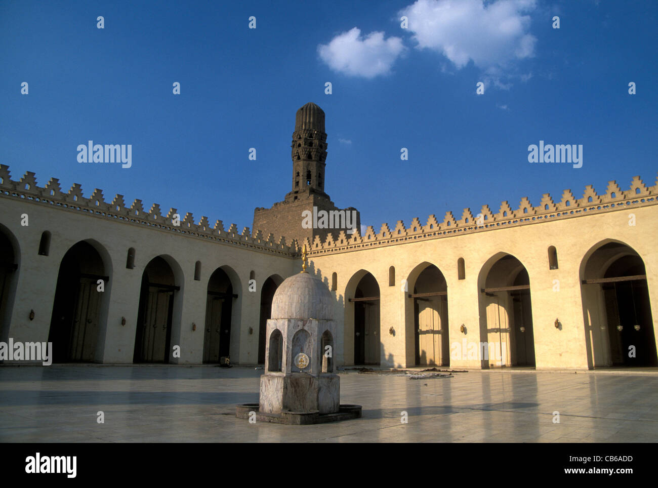 View of the courtyard, greatly restored, with ancient minaret, al Hakim Mosque, Cairo Stock Photo