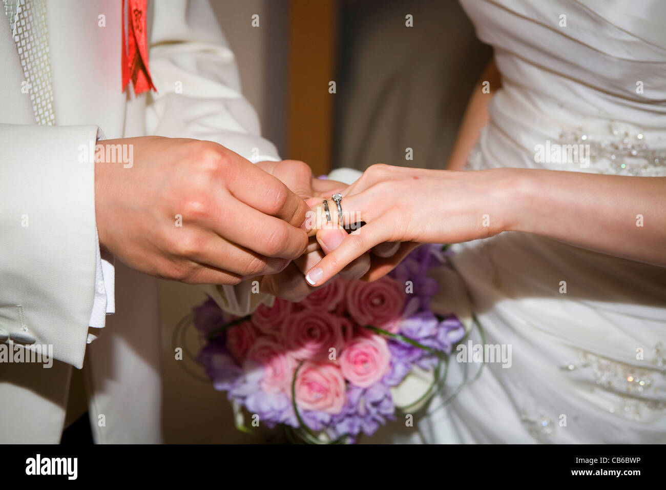Placing wedding deals ring on finger