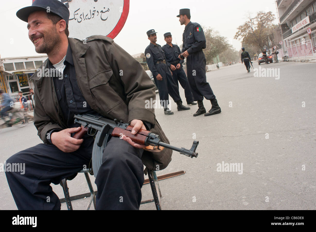 Members of the Afghan National Police (ANP) guarding a street in Kabul, Afghanistan, October 2004. Stock Photo