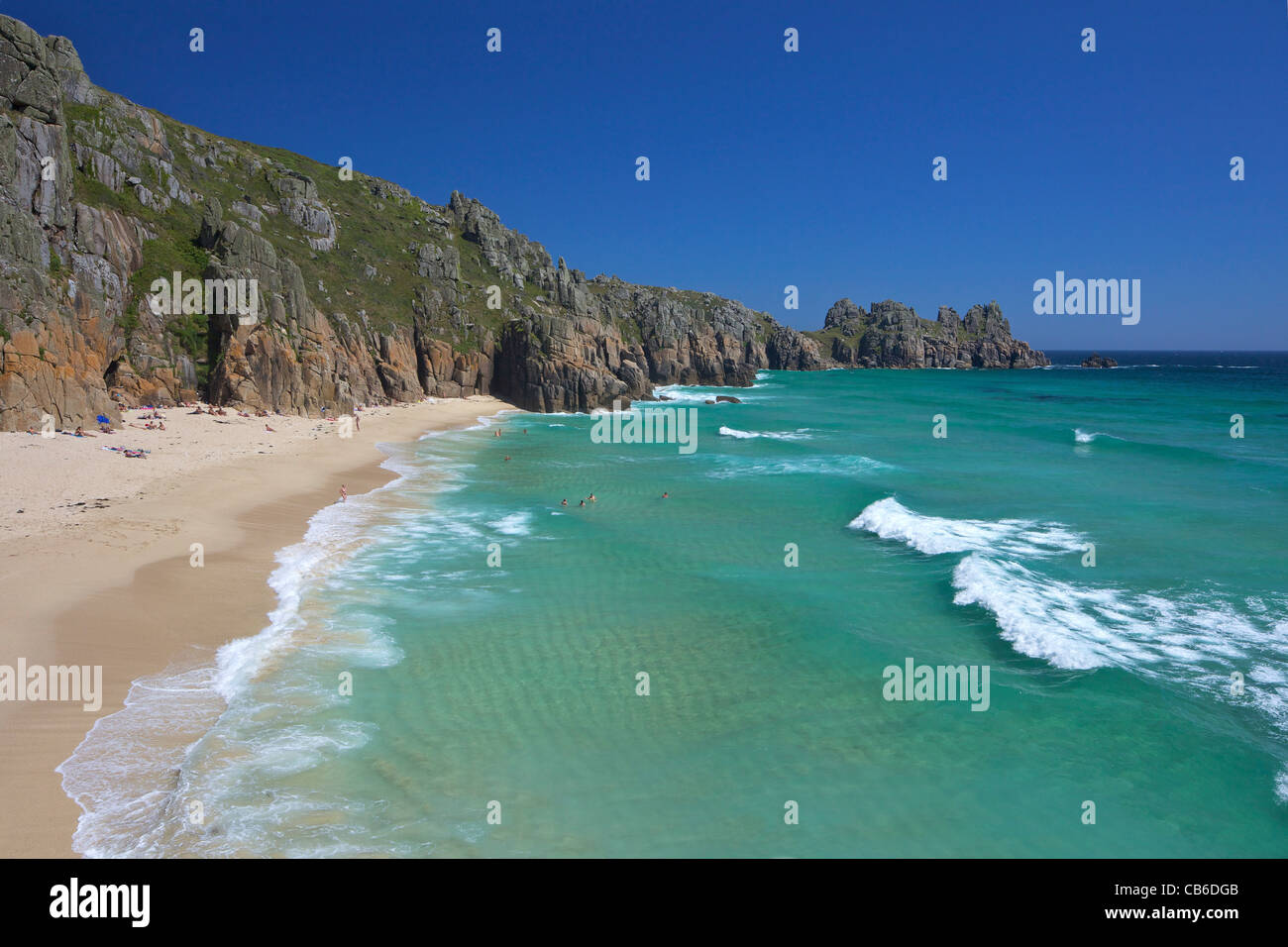 Surf and turquoise sea at Pednvounder beach in summer sunshine, Treen Cliff, near Porthcurno,  Lands End Peninsula, Cornwall Stock Photo