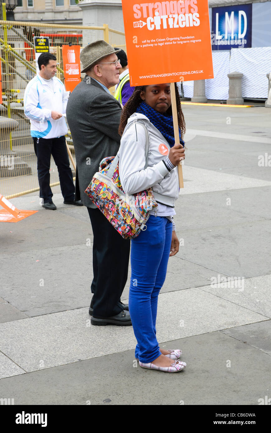 Girl holding a banner during the Strangers into Citizens campaign by the London-based Citizen Organising Foundation - May 2009 - London. England Stock Photo