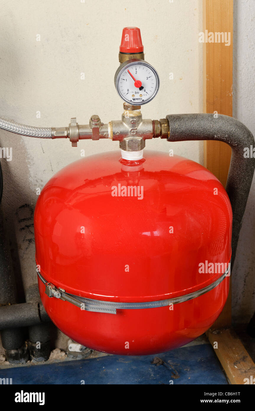 Thermal expansion tank with pressure gauge in a domestic pressurised central heating system Stock Photo