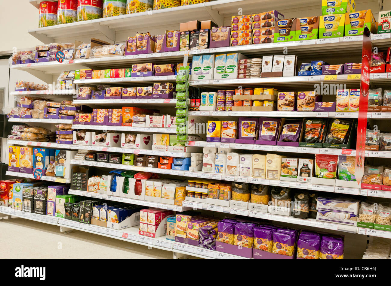 Shelves of gluten, dairy and nut free food on shelves in a Tesco store Stock Photo