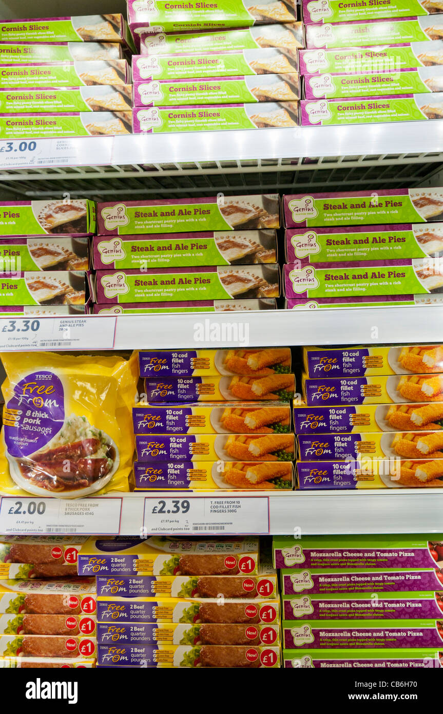 Shelves of frozen gluten, dairy and nut free food in the freezer department in a Tesco store Stock Photo