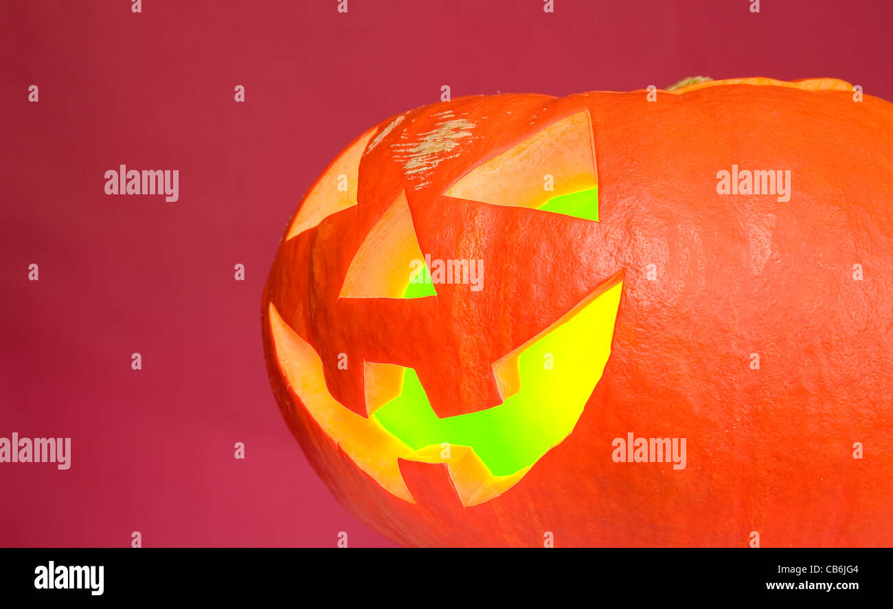 Creepy pumpkin with eyes, nose and mouth, halloween concept Stock Photo