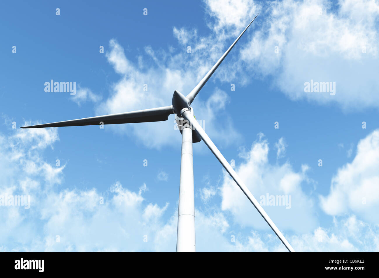 Wind Turbine under cloudy blue sky 3D render Energy Concept Stock Photo