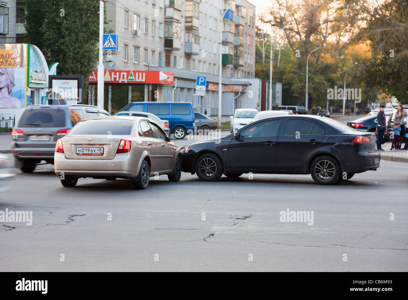 Car accident on the road, two vehicles collided, drivers looking at damage. Lipetsk, Russia Stock Photo