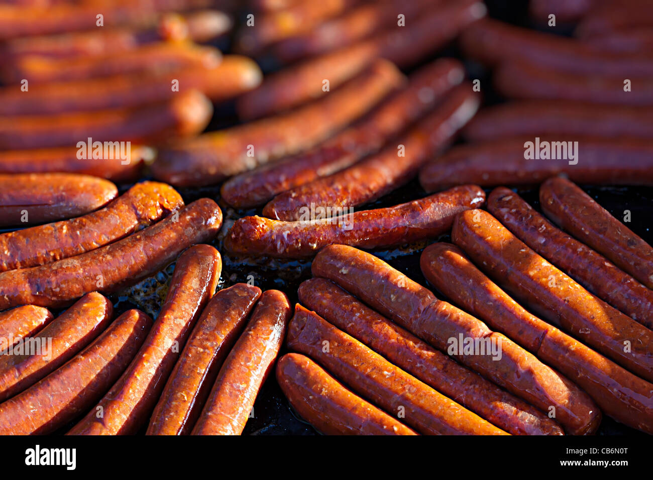 Sausages cooking Stock Photo