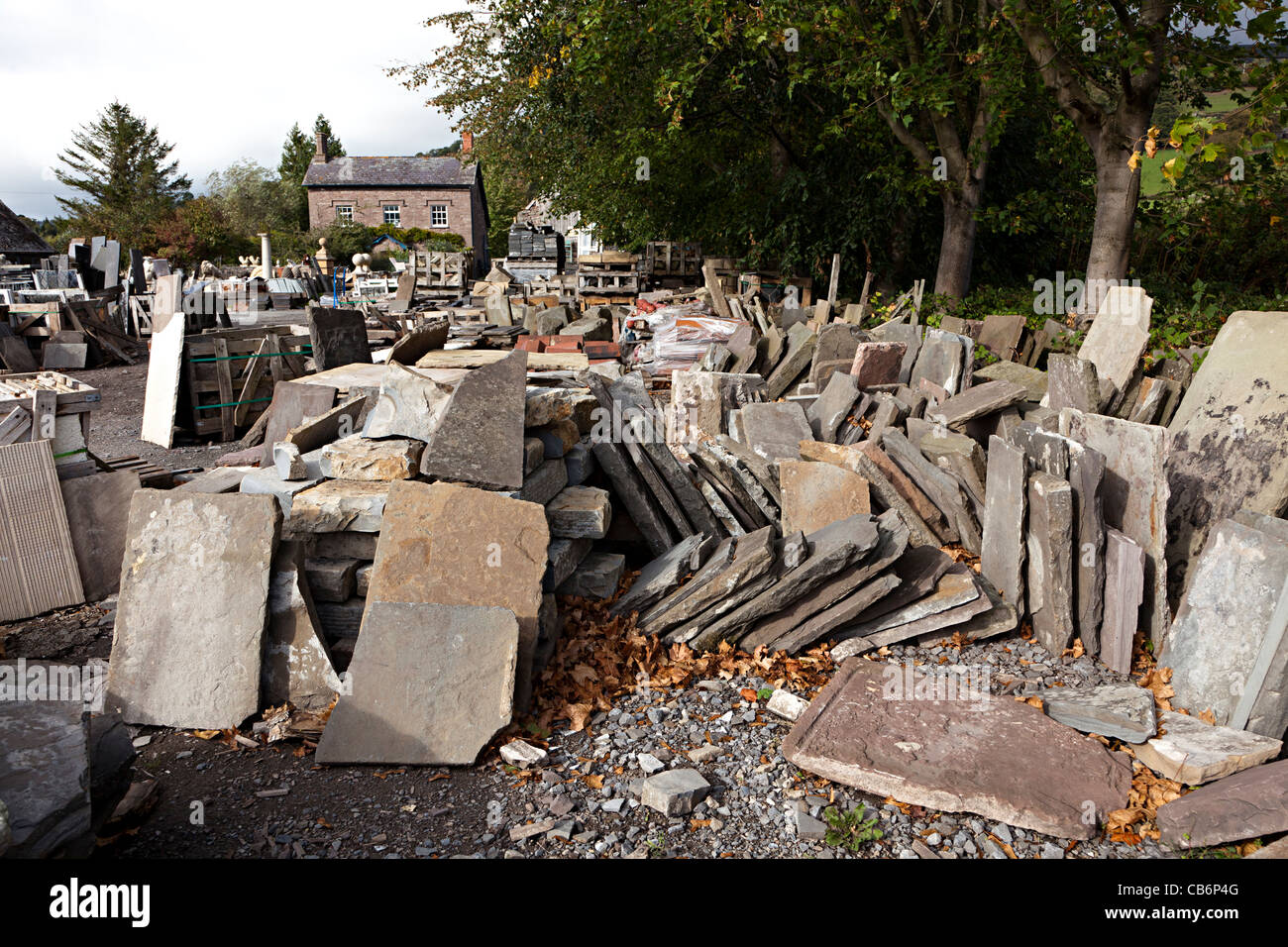 Stone slabs and flagstones in architectural salvage yard Wales UK Stock