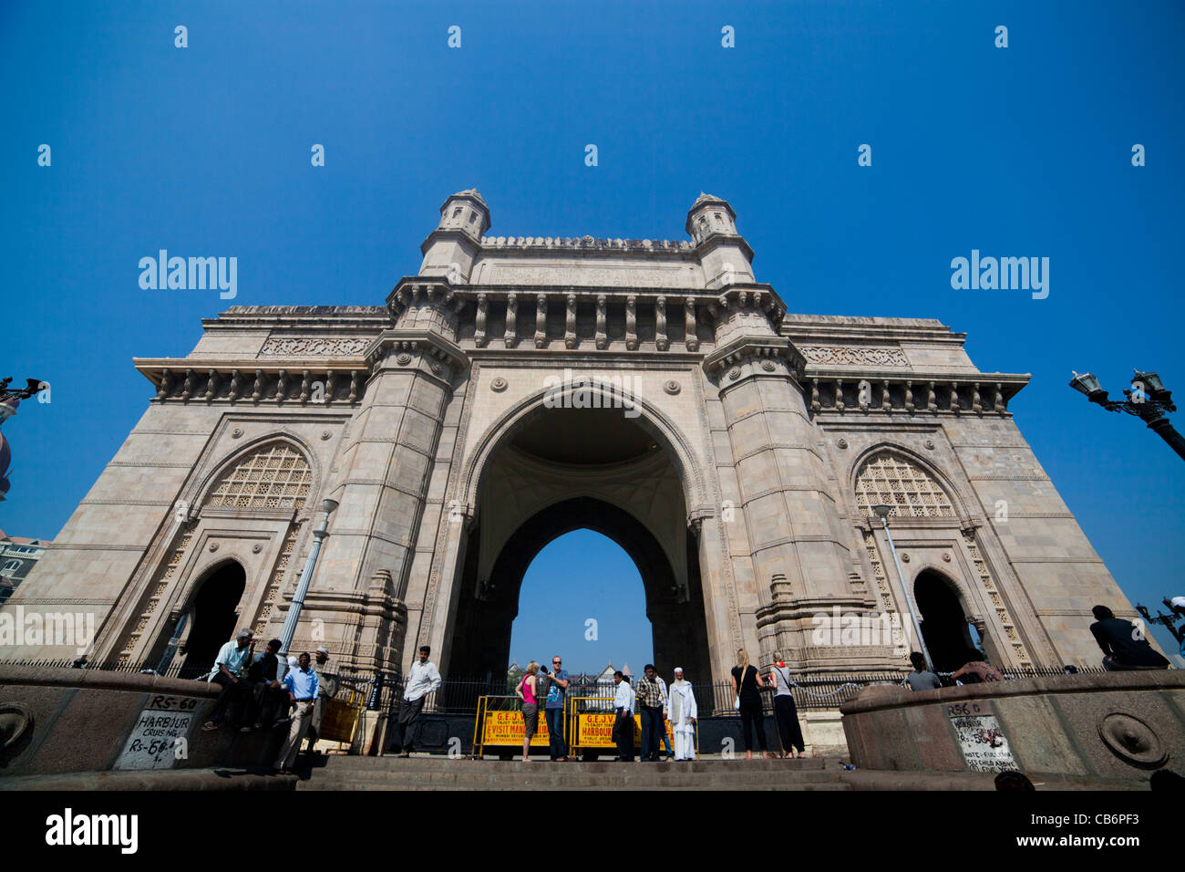 Tourists and locals outside gateway to India Stock Photo