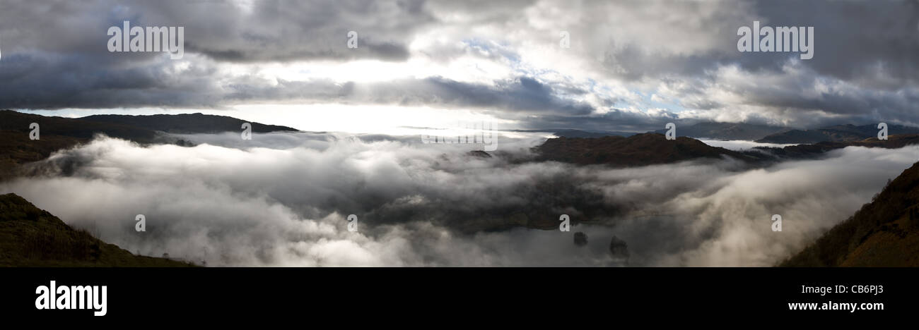 Mountain peaks rising through the morning mist, Lake District, Cumbria, England Stock Photo