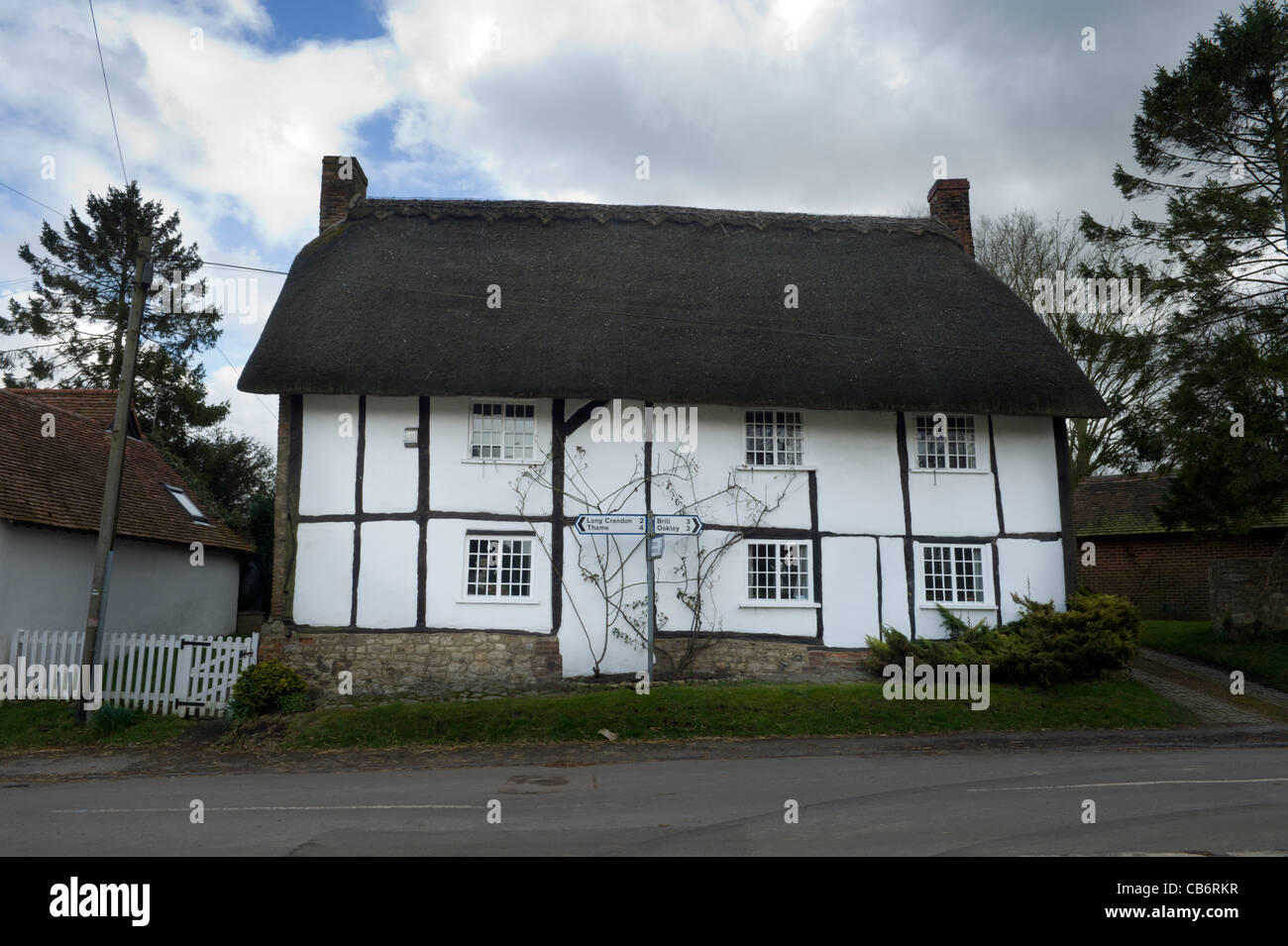 A traditional roadside thatched cottage in Chilton village Oxfordshire UK Stock Photo