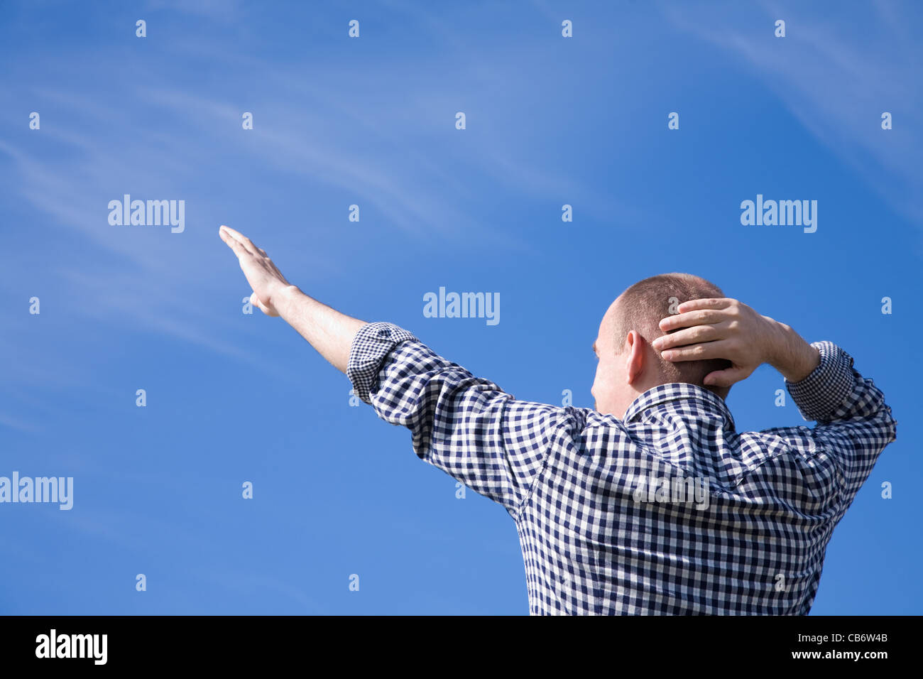 man on the blue sky background Stock Photo - Alamy