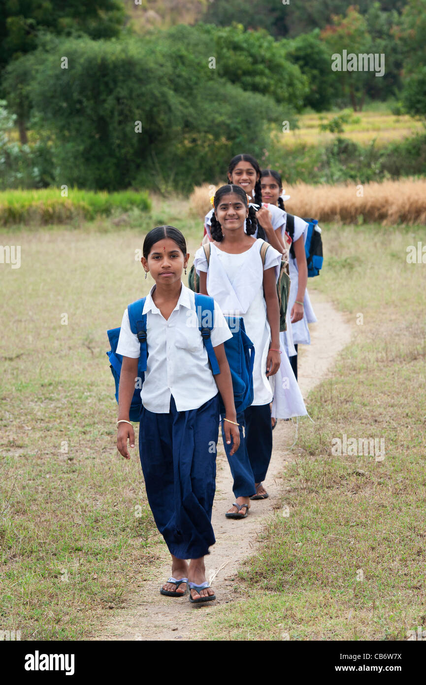 Indian girls walking to school through the Indian countryside. Andhra Pradesh, India Stock Photo