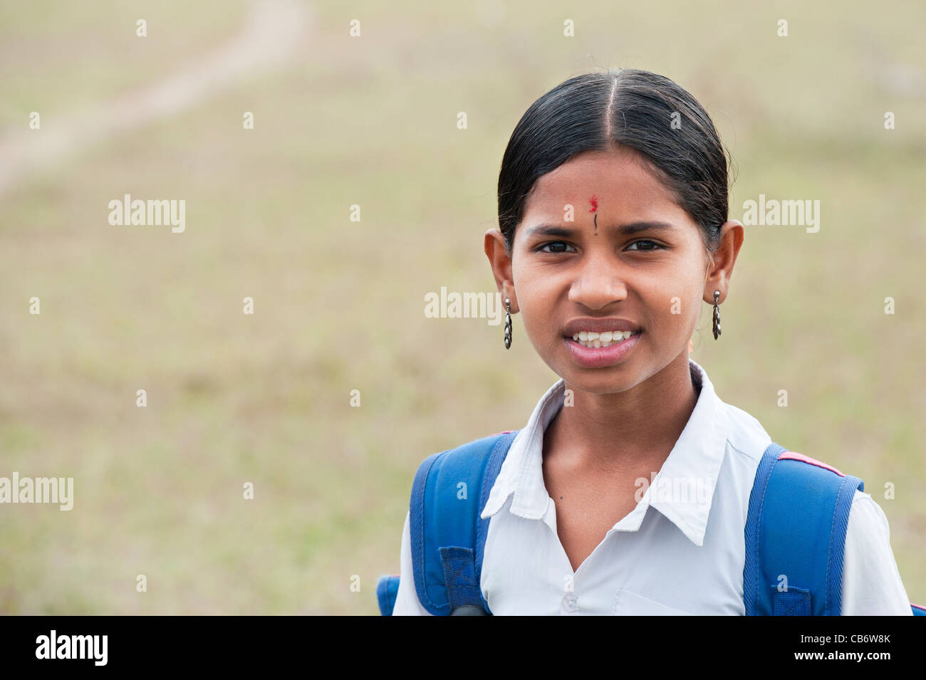 Indian girl walking to school in the indian countryside. Andhra Pradesh, India Stock Photo