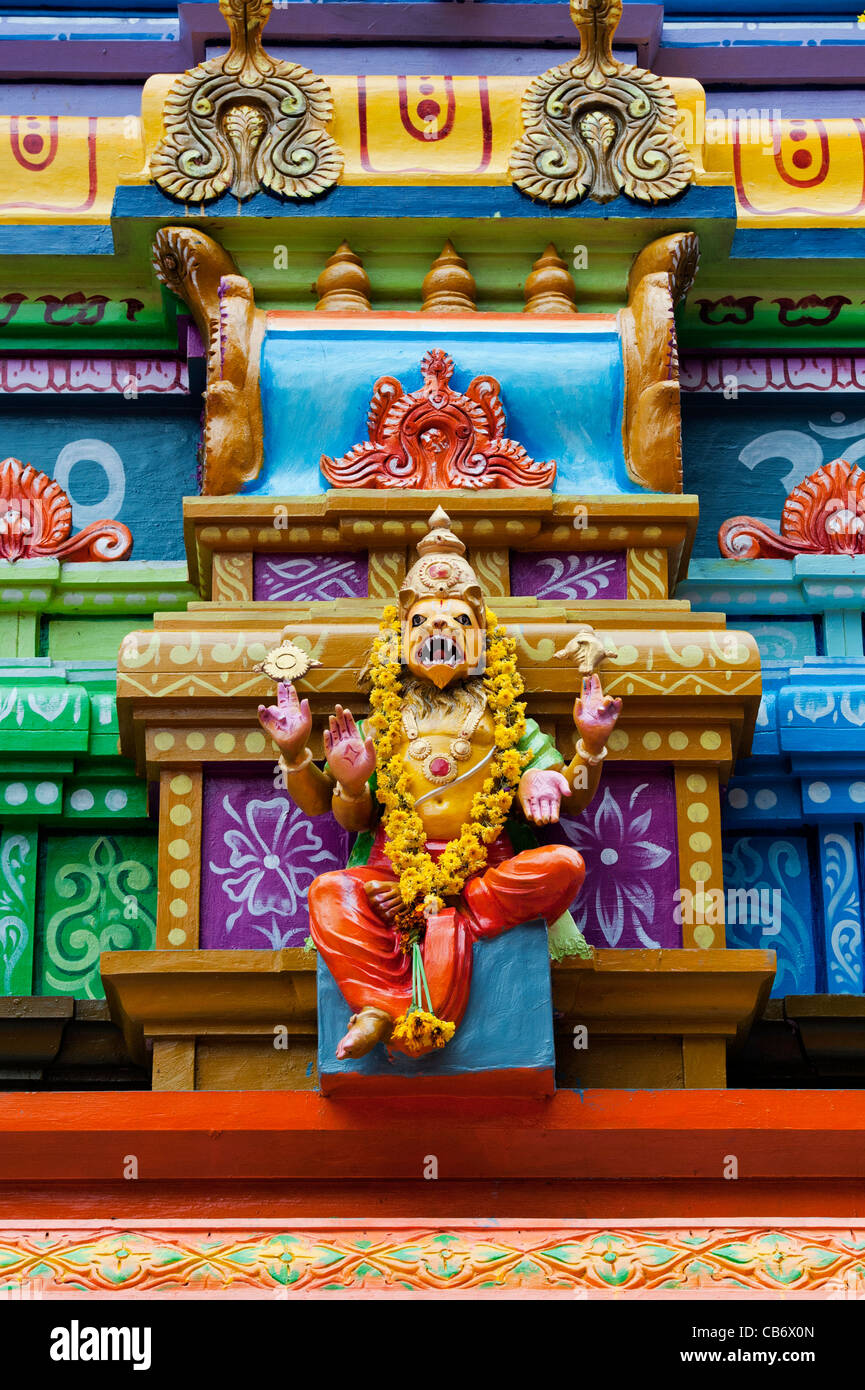 Hindu deity statue on a colourful Hindu Hanuman temple. Andhra Pradesh, India Stock Photo