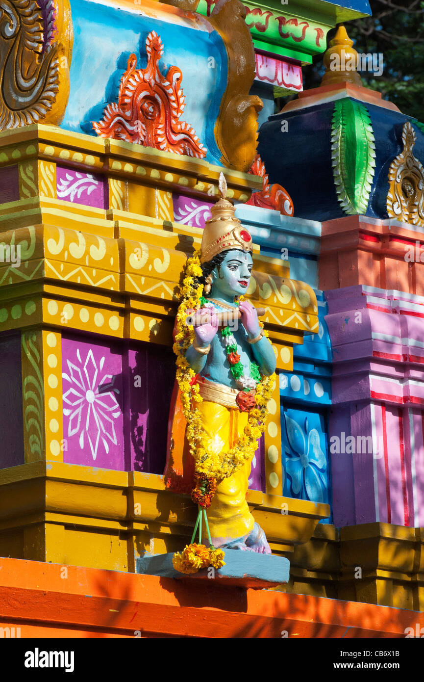 Krishna statue on a colourful Hindu Hanuman temple. Andhra Pradesh, India Stock Photo