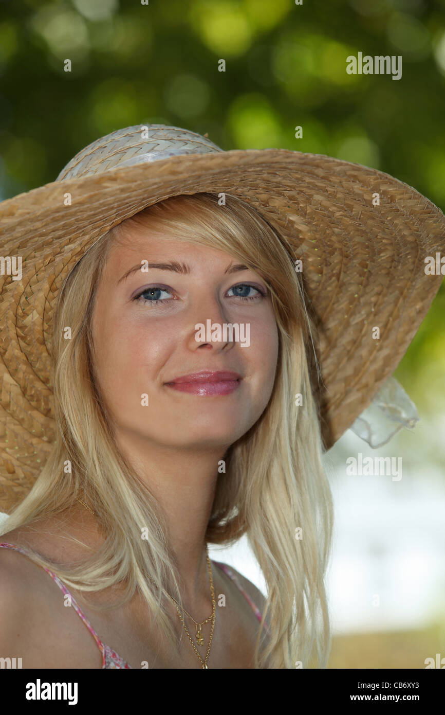beautiful young woman relaxing in a garden Stock Photo - Alamy