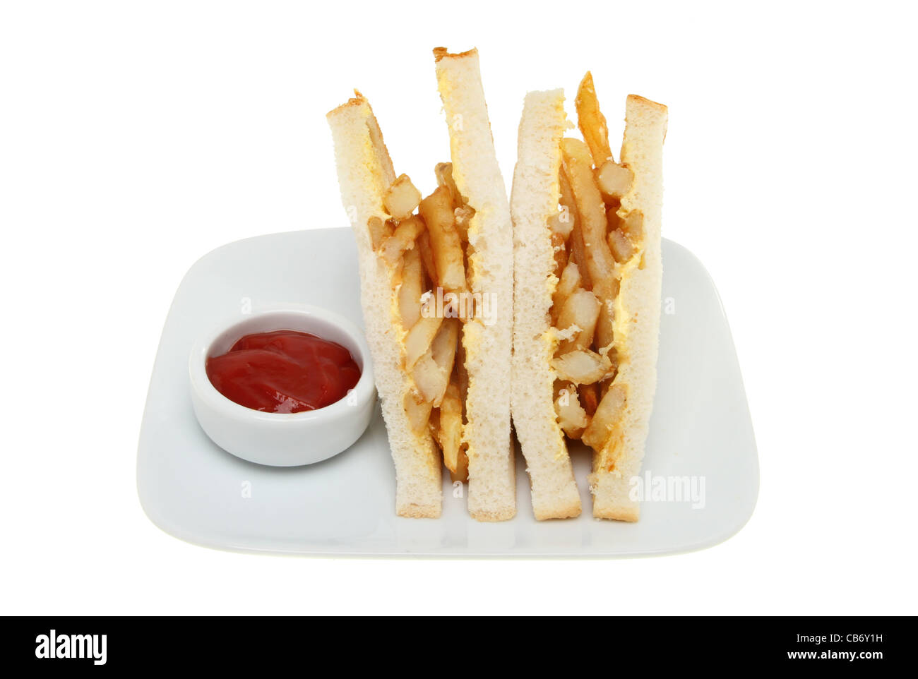 Potato chip sandwich with tomato sauce on a plate isolated against white Stock Photo
