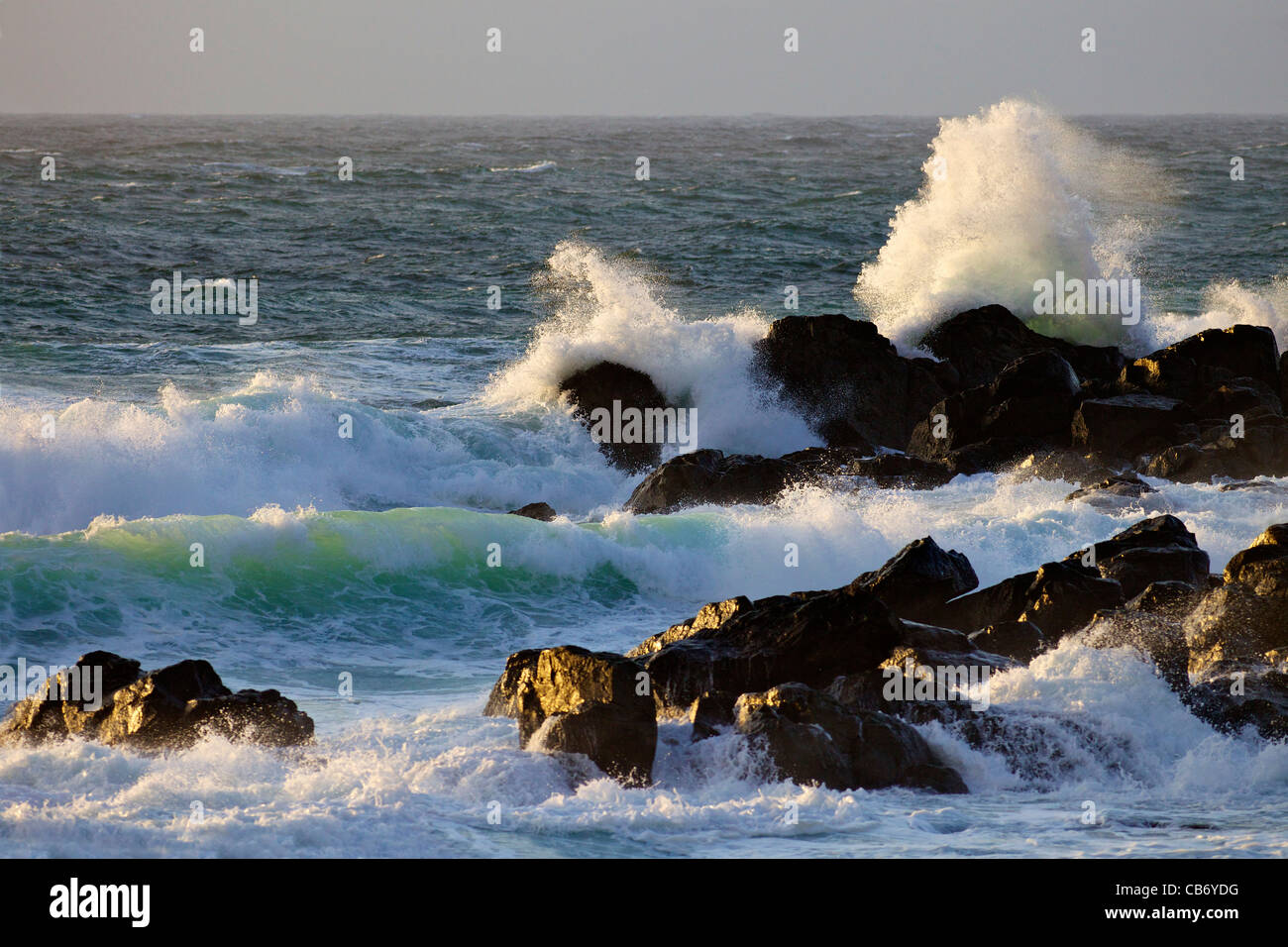 Rough seas off Porthmeor beach in evening sun, St Ives, Cornwall, Southwest England, UK, United Kingdom, GB, Great Britain Stock Photo