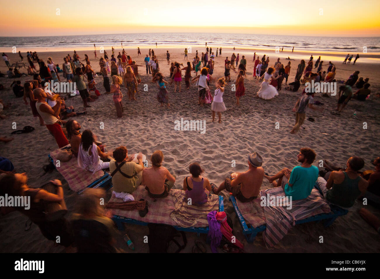 goa shore sunset dance drum sea motion merriment Stock Photo