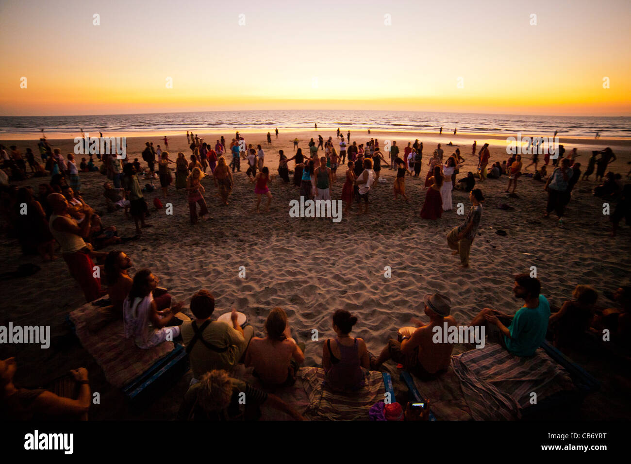 goa shore sunset dance drum sea motion merriment Stock Photo
