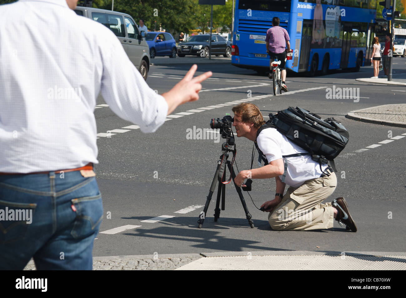 Photographer taking picture at street,. Potsdamer Platz, Berlin ...