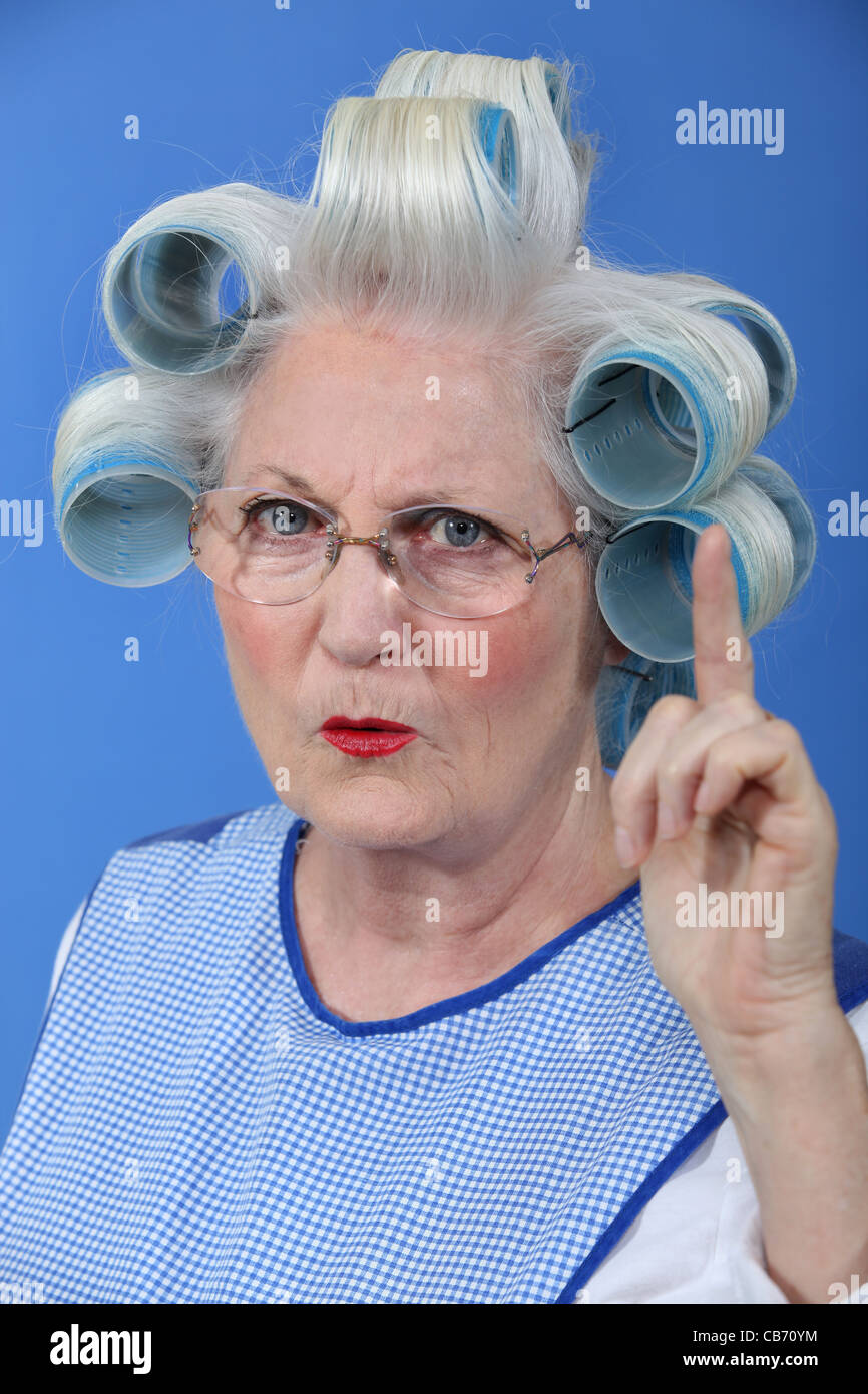 Old woman waving her finger in disapproval Stock Photo. 