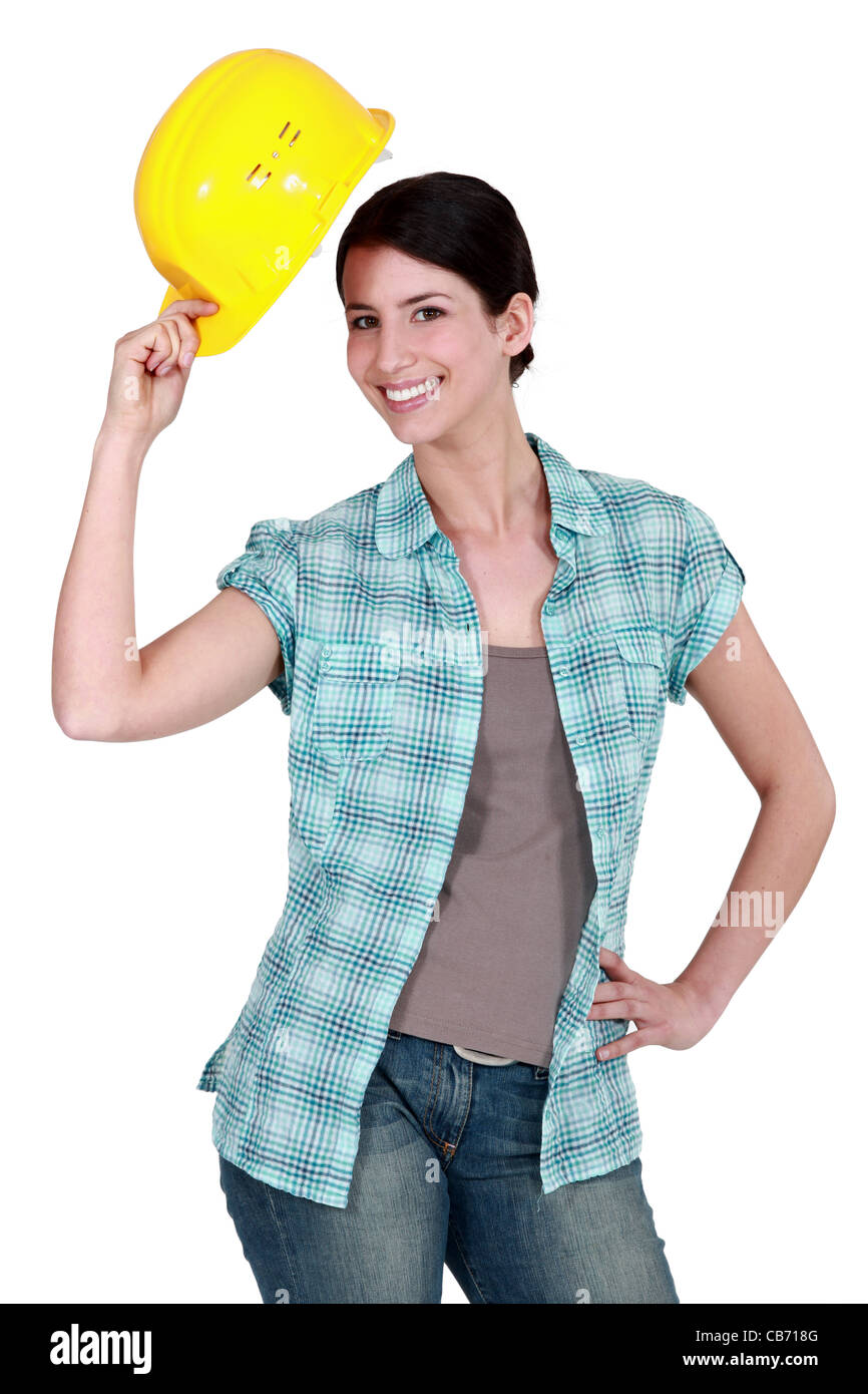Woman tipping her hard hat Stock Photo Alamy