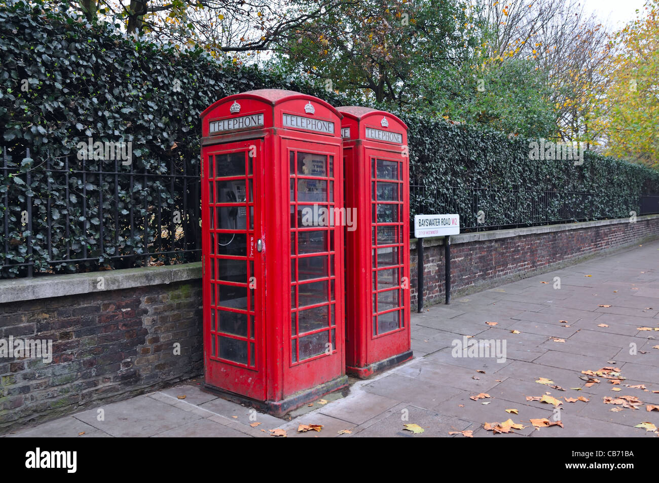 Yellow glass telephone booths with payphones are located on a pedestrian  street. Obsolete means of telephone communication in free access. Bialystok  Stock Photo - Alamy