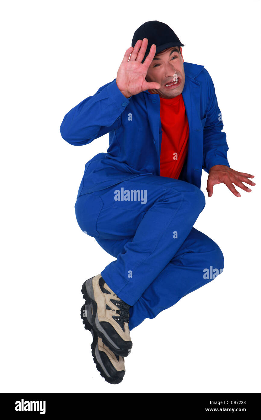 Scared manual worker Stock Photo - Alamy