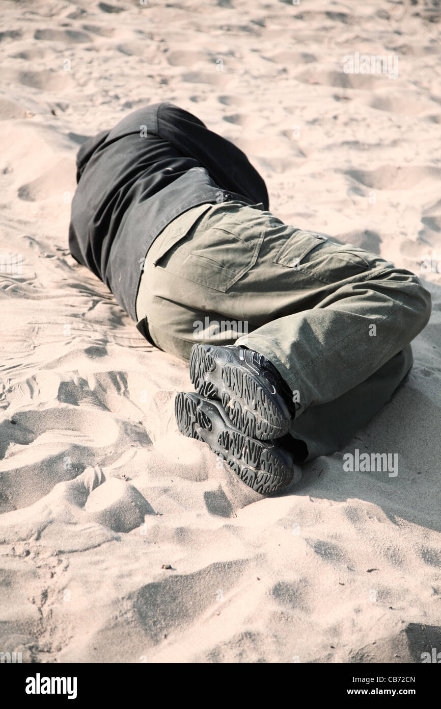 Sleep Sand homeless man sleeping on sand Stock Photo - Alamy