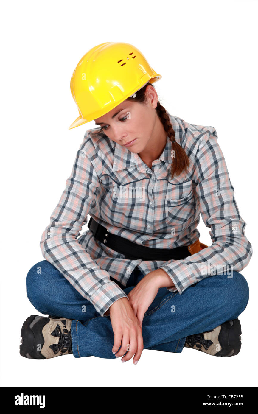 Sad female construction worker Stock Photo