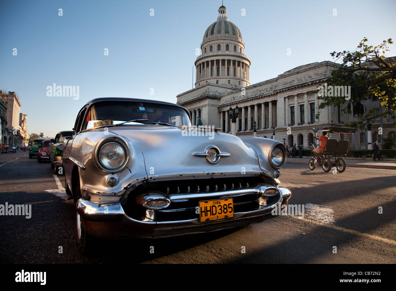 Vintage Oldsmobile parked in front of the Capitolio, Havana (La Habana), Cuba Stock Photo