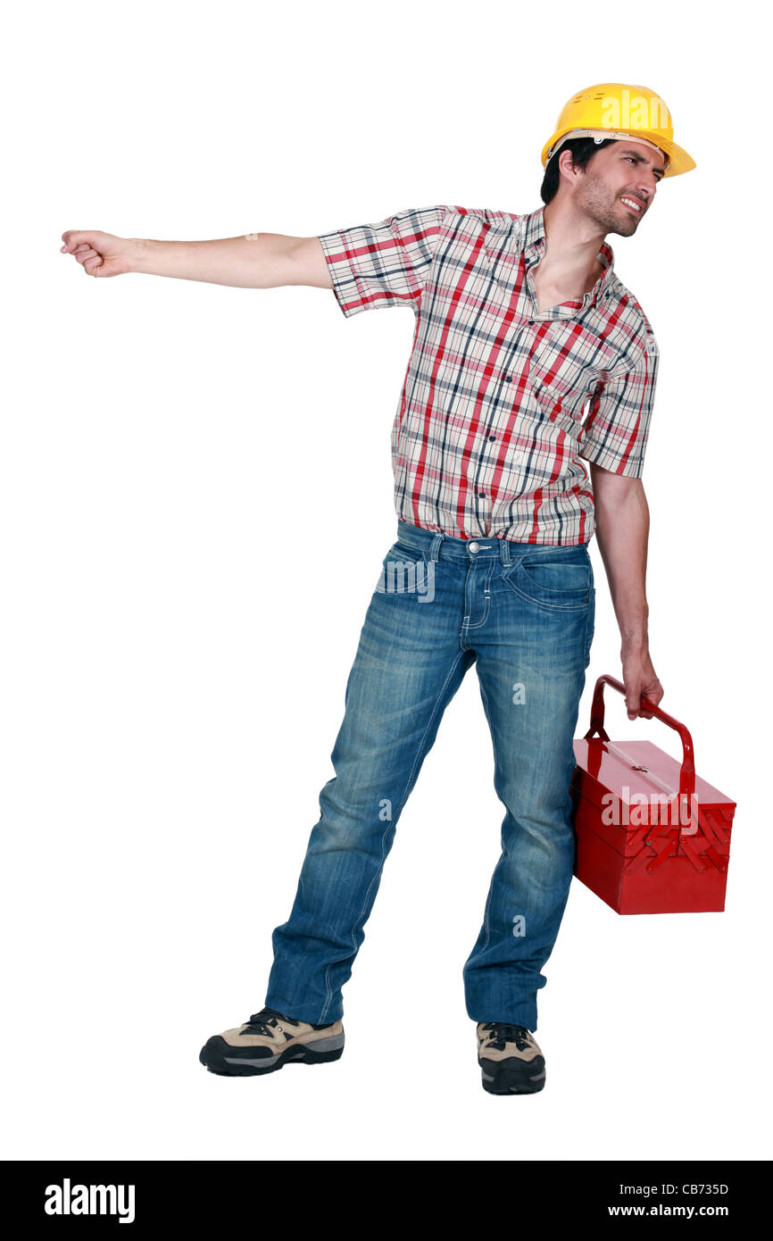 Tradesman pulling a heavy object Stock Photo Alamy