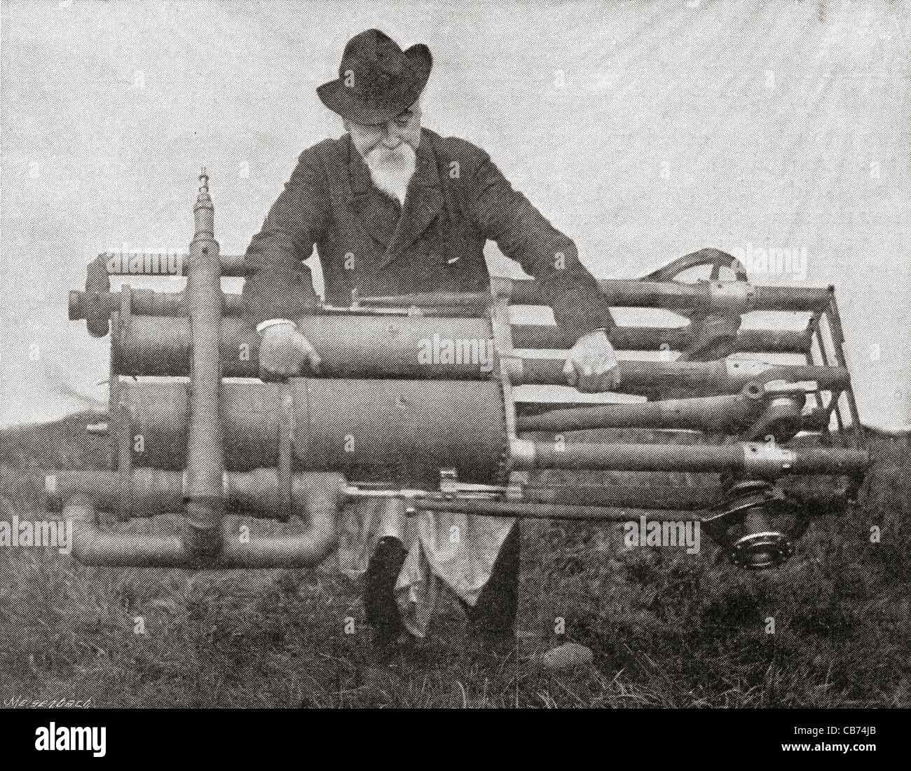 Sir Hiram Stevens Maxim holding one of his flying machine engines. Stock Photo