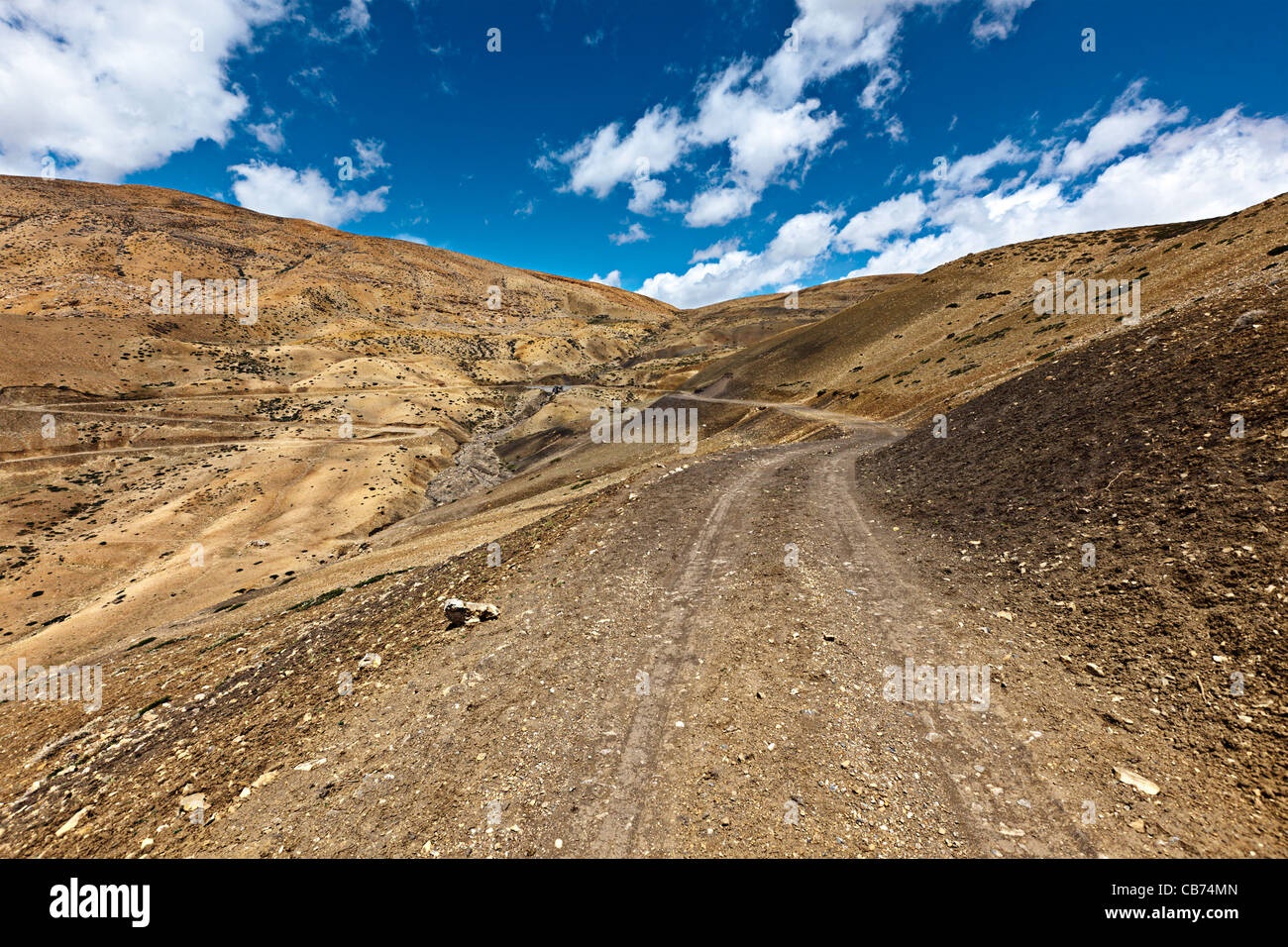 Dirt road in mountains (Himalayas). Spiti Valley, Himachal Pradesh, India Stock Photo