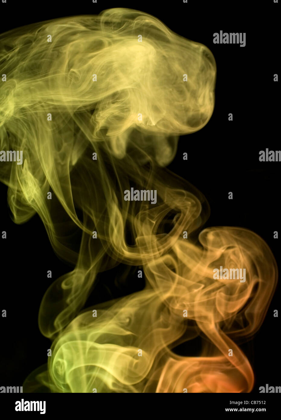 abstract picture showing some multicolored smoke in black back Stock Photo