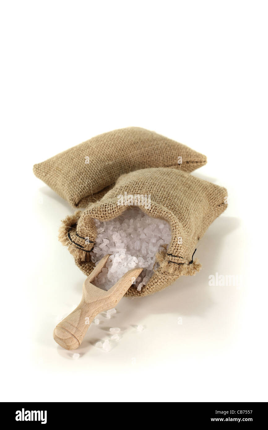 coarse salt grains in the bag with a little salt on a bushel Stock