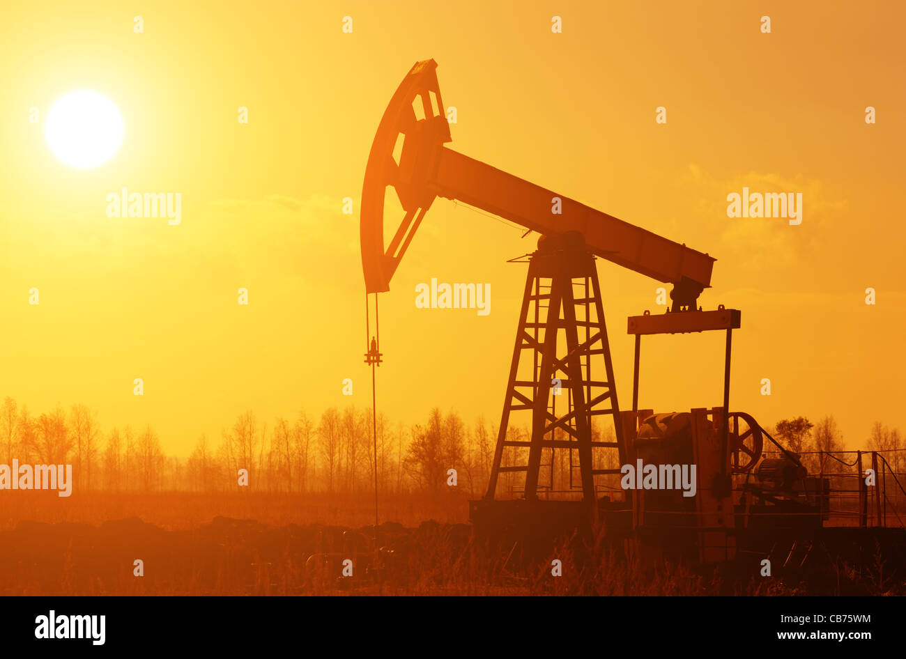 oil rig on the plains selective focus on nearest Stock Photo